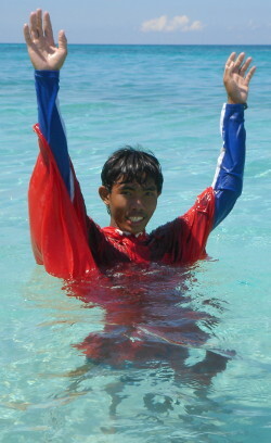 Lifeguard signals both hands up danger